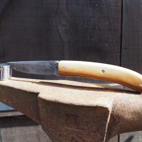 Couteau pliant en Damas torsadé manche en thibia de mammouth